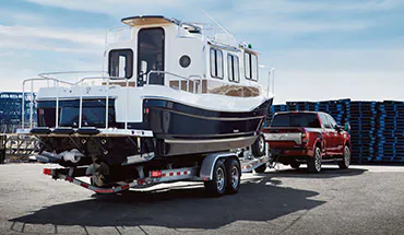 2022 Nissan TITAN Truck towing boat | Ted Russell Nissan in Knoxville TN