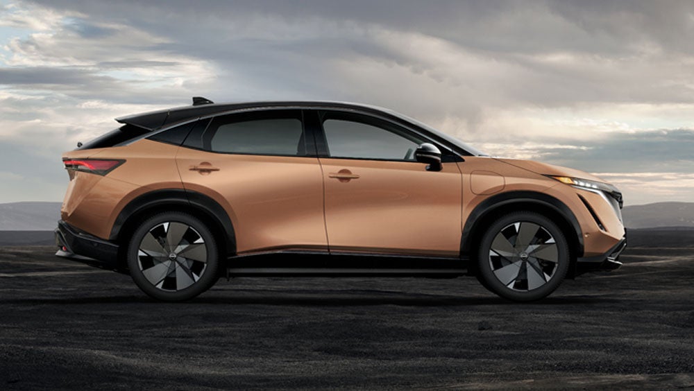 Nissan ARIYA in Sunrise Copper in dramatic landscape | Ted Russell Nissan in Knoxville TN